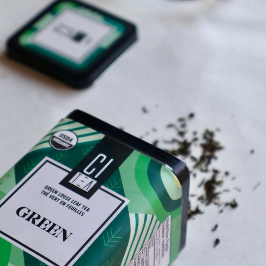 Green tea box spilled on white table