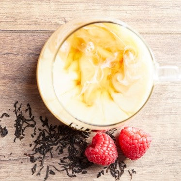 Earl grey with cream on wood background with black tea 