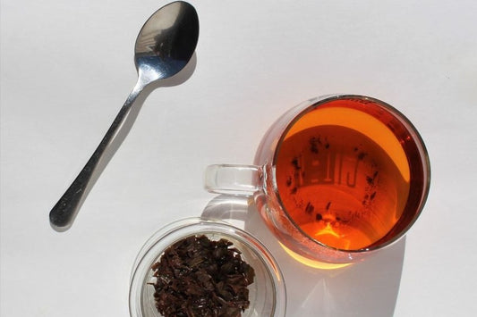Orange Pekoe Tea in a tea cup on a white background